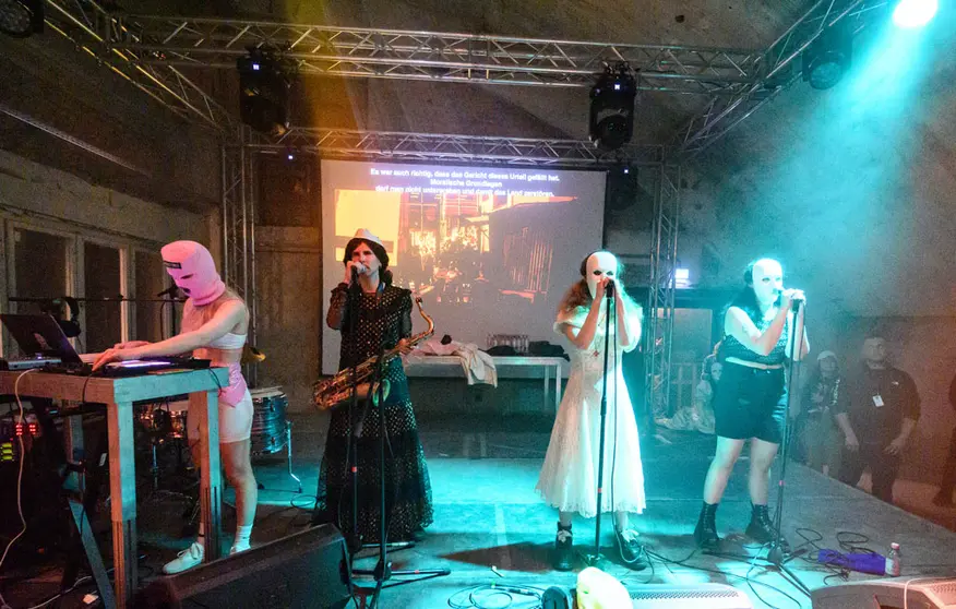 12 May 2022, Berlin: (L-R) Members of the Russian musical group Pussy Riot Diana Burkot, Anton Ponomarev, Maria Alyokhina and Olga Borisova perform during their concert at Funkhaus Berlin. Photo: Bernd von Jutrczenka/dpa.