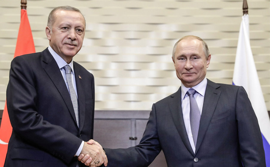 FILED - 22 October 2019, Russia, Sochi: Russian President Vladimir Putin (R) shakes hands with Turkish President Recep Tayyip Erdogan duirng a meeting. Putin and Erdogan will discuss by phone the situation in Ukraine in the context of Russia's continuation of its military operations in the country. Photo: -/Kremlin/dpa - ATTENTION: editorial use only and only if the credit mentioned above is referenced in full.