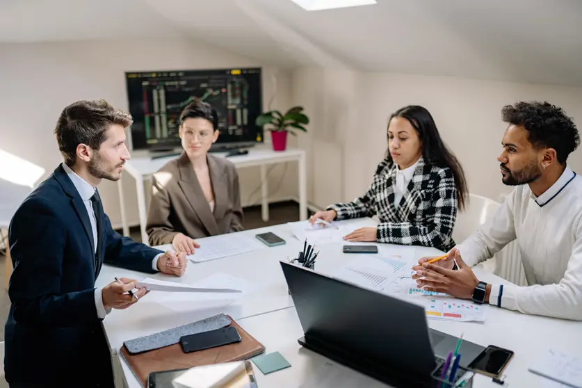 A work team, during a group meeting in a company. Photo: Yan Krukov/Pexels.