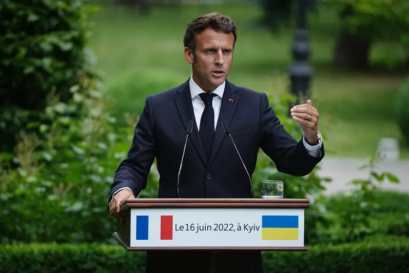 FILED - 16 June 2022, Ukraine, Kiev: French President Emmanuel Macron speaks during a joint press conference with Ukrainian President Volodymyr Zelensky, German Chancellor Olaf Scholz, Italian Prime Minister Mario Draghi and Romanian President Klaus Iohannis after their meeting. A second and final round of parliamentary elections began in France on Sunday, with President Emmanuel Macron aiming to resecure an absolute majority for members of his centrist La Republique en Marche (The Republic on the Move, LREM) party. Photo: Kay Nietfeld/dpa.