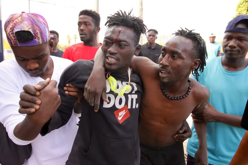 24 June 2022, Spain, Melilla: A group of migrants make their way to the Temporary Immigration Center (CETI) as they celebrate crossing the Melilla fence. Photo: Antonio Ruiz/EUROPA PRESS/dpa.