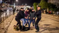 Jerusalem (Palestinian Territories): Israeli undercover police force arrest protesters during clashes with Palestinians at Damascus Gate by the entrance to Jerusalem's Old City. Photo: Ilia Yefimovich/dpa.