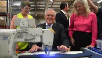 Sydney (Australia): Australian Prime Minister Scott Morrison (C) sewing during a visit to SpanSet webbing based facility on Day 3 of the 2022 federal election campaign. Photo: Mick Tsikas/dpa.