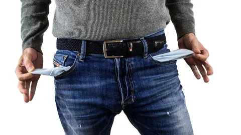 Man-empty-pockets-jeans-debt-money-bankrupt. by  Darko Djurin