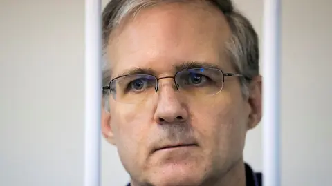 FILE PHOTO: Former U.S. Marine Paul Whelan, who was detained and accused of espionage, stands inside a defendants' cage during a court hearing on extending his pre-trial detention, in Moscow, Russia October 24, 2019. REUTERS/Tatyana Makeyeva/File Photo