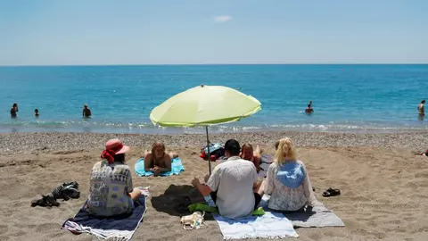 FILE PHOTO: People enjoy on La Malagueta beach as some Spanish provinces are allowed to ease lockdown restrictions during phase two, amid the coronavirus disease (COVID-19) outbreak, in Malaga, southern Spain June 1, 2020. REUTERS/Jon Nazca