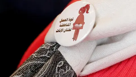 A badge reads &#34;The power of labor aginst FGM&#34; is seen on a volunteer during a conference on International Day of Zero Tolerance for Female Genital Mutilation (FGM) in Cairo, Egypt February 6, 2018. REUTERS/Amr Abdallah Dalsh TPX IMAGES OF THE DAY