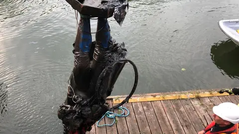 Photograph taken with permission from the Twitter feed of Bristol City Council showing the statue of slave trader Edward Colston being removed from the harbour where it was dumped by anti-racism protesters on Sunday. Photo: Bristol City Council/PA Media/dpa