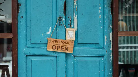 Welcome-open-wooden-door