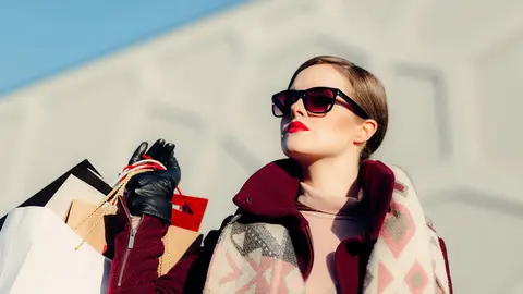 Woman-shopping-bags-sun-glasses-red-lips Photo: Pixabay.
