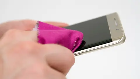 A smartphone is best cleaned with a soft, lint-free, slightly moistened microfibre cloth. Photo: Andrea Warnecke/dpa