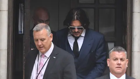 England, London: US actor Johnny Depp (C) leaves the High Court after giving evidence in his libel case against the publishers of The Sun and its executive editor Dan Wootton, because of an article which claimed that he physically abused his ex-wife. Photo: Kirsty O'connor/PA Wire/dpa