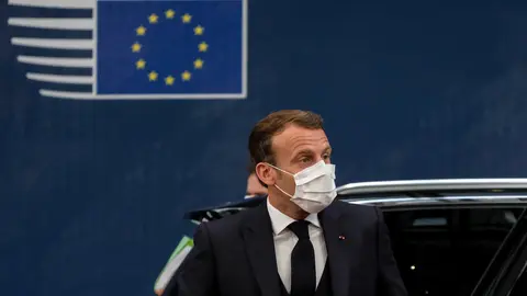 French President Emmanuel Macron wears a face mask as he arrives to attend the second day of the European Council special summit. Photo: European Council/dpa.