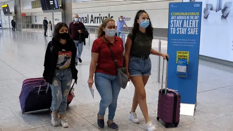 England, London: Passengers on a flight from Madrid arrive at Heathrow Airport, following an announcement on Saturday that holidaymakers who had not returned from Spain and its islands by midnight would be forced to quarantine for 14 days. Photo: Andrew Matthews/dpa.