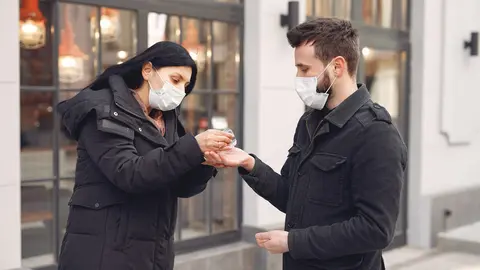 Woman-man-mask-couple-hand-sanitizer