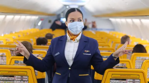 A crew member on board a Ryanair plane. Photo: Ryanair.
