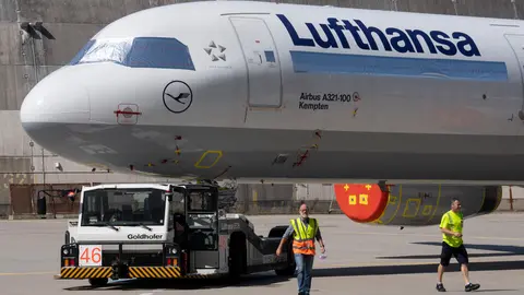 30 July 2020, Hessen, Frankfurt_Main: A Lufthansa passenger aircraft is towed to the airline's technical hangar at Frankfurt Airport as Lufthansa started reactivating some of its aircraft that were laid off during the peak of the coronavirus pandemic. Photo: Boris Roessler/dpa