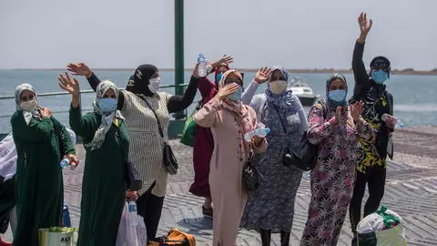 18 July 2020, Spain, Huelva: Moroccan seasonal workers embark a ferry from the south quay of the Port of Huelva on their way towards Morocco. Photo: María José López/dpa.