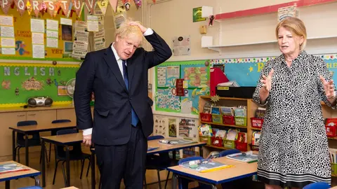 10 August 2020, England, London: Head teacher Bernadette Matthews (R) shows UK Prime Minister Boris Johnson the new measures being implemented to ensure children can return to school safely in September during his visit to St Joseph's Catholic Primary School. Photo: Lucy Young/dpa.