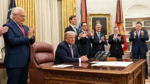 HANDOUT - 13 August 2020, US, Washington: US President Donald Trump, joined by White House senior staff members, as he delivers a statement in the Oval Office of the White House to announce that the United Arab Emirates and Israel have agreed to establish full diplomatic ties. Photo: Joyce N. Boghosian/dpa.