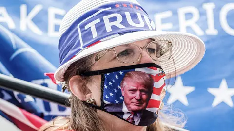 24 August 2020, US, Charlotte: A supporter of the US President Donald Trump takes part in rally during the opening day of the Republican National Convention. Photo: Sean Meyers/dpa.