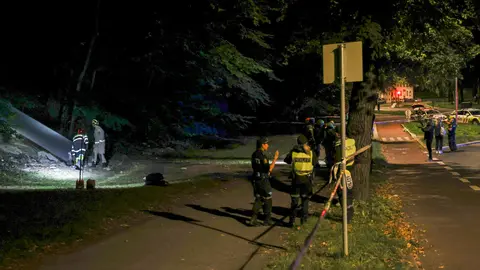 30 August 2020, Norway, Oslo: Rescue workers stand at the scene, where at least 24 people, mainly young people, were taken to hospital with suspected carbon monoxide poisoning after attending a party in an underground bunker. Photo: Geir Olsen/dpa