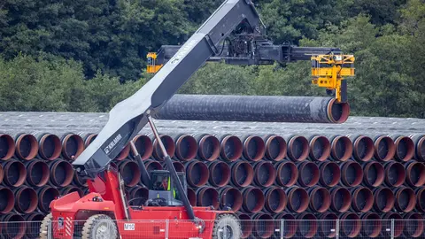 08 September 2020, Mecklenburg-Western Pomerania, Mukran: A special vehicle transports a pipe for the Nord Stream 2 natural gas pipeline to a storage yard at the port of Mukran on the island of Ruegen. Special ships are being prepared in the port for the further construction of the Nord Stream 2 Baltic Sea pipeline. Photo: Jens Büttner/dpa.
