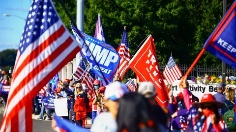 03 October 2020, US, Bethesda: Supporters of US President Donald Trump gather in front of the Walter Reed Military Hospital in Bethesda, where Trump is being treated after a coronavirus infection. Photo: Steven Ramaherison/dpa.