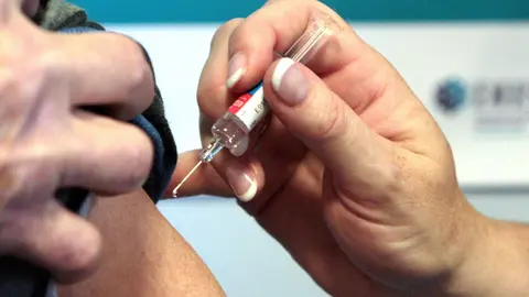 File photo dated 05/10/09 of a person receiving a vaccination. Photo: David Cheskin/dpa.
