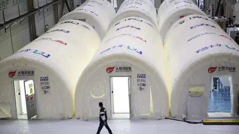 14 October 2020, China, Qingdao: A man walks in the Huo Yan laboratory after it comes into service as nine people were found infected with coronavirus (COVID-19). Photo: TPG/dpa.