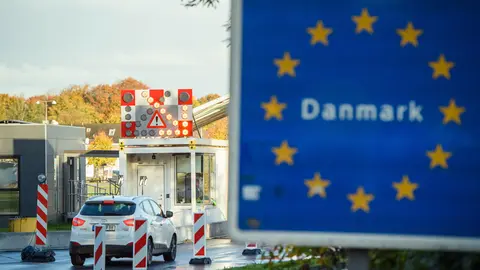 24 October 2020, Schleswig-Holstein, Flensburg: Vehicles drive past the borders near Flensburg from Germany into Denmark. As of Saturday entry from Germany has been subjected to restrictions after Denmark declared Germany as a risk country amid the rising numbers of coronavirus infections. Photo: Gregor Fischer/dpa.