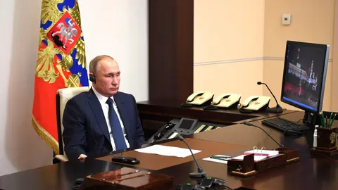 HANDOUT - 09 November 2020, Russia, Moscow: Russian President Vladimir Putin attends a video conference call with Syrian President Bashar al-Assad from the Novo-Ogaryovo state residence. Photo: -/Kremlin/dpa.
