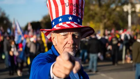 14 November 2020, US, Washington: A supporter of the US President Donald Trump dressed as Uncle Sam takes part in the 'Million Maga March' protest against the results of the 2020 presidential election. Photo: -/Imagespace/dpa.