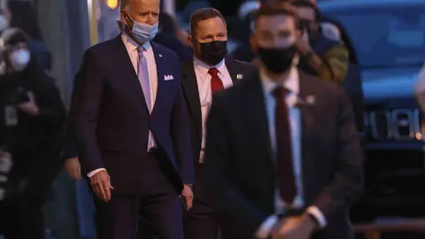 24 November 2020, US, Wilmington: US President-elect Joe Biden (L) leaves the Queen theatre after introducing his nominees and appointees to key national security and foreign policy. Photo: Saquan Stimpson/ZUMA Wire/dpa