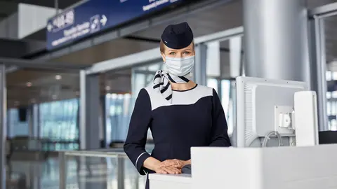 Finnair Airport Stewardess cabin crew at Gate 3 by Finnair.