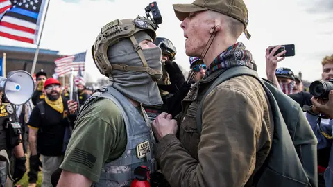 12 December 2020, US, Washington Dc: A member of the the far-right, neo-fascist and male-only political organization "Proud Boys" clashes with another member of the left-wing anti-fascist political movement "Antifa" during a protest in support of President Donald Trump. Photo: Allison Dinner/ZUMA Wire/dpa