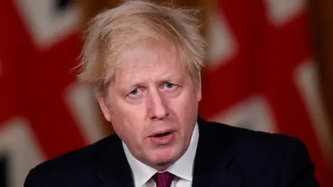 19 December 2020, England, London: UK Prime Minister Boris Johnson speaks during a press conference in response to the ongoing situation with the coronavirus (Covid-19) pandemic at 10 Downing Street. Photo: Toby Melville/PA Wire/dpa
