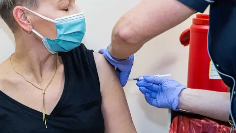 27 December 2020, Poland, Wroclaw: A man receives his dose of the Biontech/Pfizer COVID-19 vaccine at a hospital in Wroclaw. Photo: Krzysztof Kaniewski/ZUMA Wire/dpa.