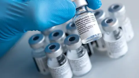 FILED - 10 January 2021, Bavaria, Pfaffenhofen a.d.Ilm: A health worker holds a Biontech and Pfizer coronavirus (Covid-19) vaccine vial during a vaccination campaign. German vaccine developer BioNTech pledged early Monday to ramp up its deliveries to the European Union by up to 75 million additional doses in the second quarter, amid huge pressure on Germany and other countries to speed up vaccinations. Photo: Sven Hoppe/dpa/dpa-tmn