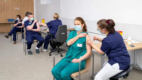 Health personnel receiving the Covid-19 vaccine in Helsinki. Photo: @HUS.