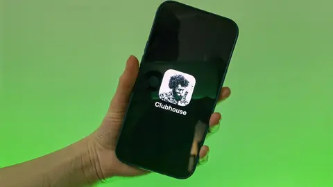 FILED - A user of the Clubhouse social media app shows her smartphone with the logo of the audio application. The new social media app Clubhouse will in future also be able to run on smartphones with the Google Android operating system. Photo: Christoph Dernbach / dpa