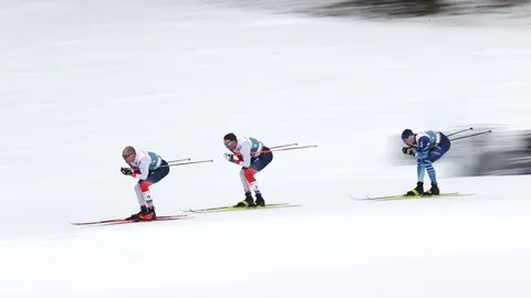 07 March 2021, Bavaria, Oberstdorf: (L-R) Norway's Paal Golberg, Norway's Emil Iversen and Finland's Iivo Niskanen in action during the men's 50 kilometre classical mass start event at the FIS Nordic World Ski Championships in Oberstdorf. Photo: Daniel Karmann/dpa
