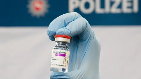 FILED - 04 March 2021, Lower Saxony, Hanover: A doctor holds a vial of AstraZeneca's Covid-19 vaccine at the Lower Saxony Central Police Directorate. Germany has suspended use of the Covid-19 vaccine developed by AstraZeneca, the Health Ministry said. Photo: Julian Stratenschulte/dpa