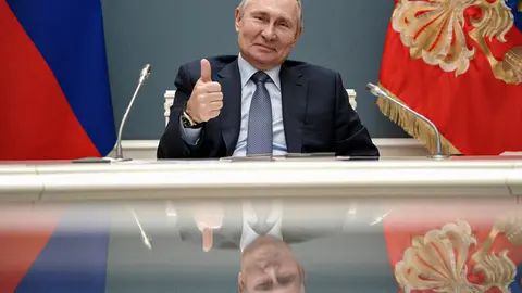 HANDOUT - Russian President Vladimir Putin gestures during a via videoconference call with Turkish President Recep Tayyip Erdogan on March 10. Responding to President Joe Biden's remark that he thinks the Russian president is a "killer," Vladimir Putin on Thursday suggested the US leader should take stock of his own flaws and wished him "good health." Photo: -/Kremlin/dpa - ATTENTION: editorial use only and only if the credit mentioned above is referenced in full