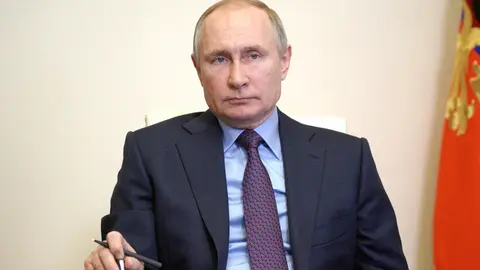 HANDOUT - 22 March 2021, Russia, Moscow: Russian President Vladimir Putin speaks during a videoconference meeting on increasing vaccine production and the course of vaccination against Coronavirus (Covid-19) in Russia. Photo: -/Kremlin/dpa - ATTENTION: editorial use only and only if the credit mentioned above is referenced in full
