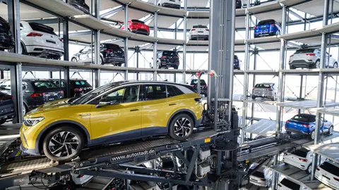 26 March 2021, Lower Saxony, Wolfsburg: A Volkswagen ID.4 stands in a car tower at Autostadt where the German Automaker company started deliveries of the all-electric SUV today. Photo: Ole Spata/dpa