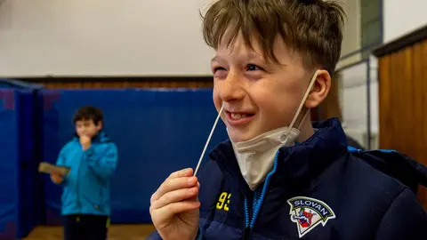 A child takes a nose swab for himself for a coronavirus test at Chabarovice primary school. The Czech government has decided that primary one pupils will return to the classrooms in a rotating format, with only half of the pupils in the classrooms. Photo: Hájek Ondøej/CTK/dpa