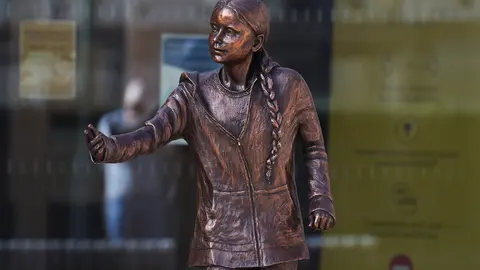 30 March 2021, United Kingdom, Winchester: The statue of Swedish climate change activist Greta Thunberg can be seen outside the University of Winchester's West Down Centre. Photo: Andrew Matthews/PA Wire/dpa