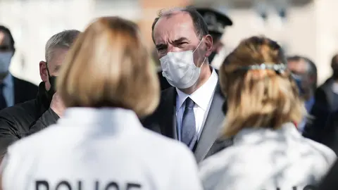 French Prime Minister Jean Castex speaking to police officers at the crime scene. Photo: Twitter/@JeanCASTEX
