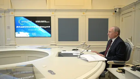 HANDOUT - 22 April 2021, Russia, Moscow: Russian President Vladimir Putin participates in the international climate summit via video. The meeting is intended to underline the urgency and economic benefits of stronger climate protection measures on the way to the United Nations Climate Change Conference (COP26) in Glasgow next November. Around 40 international leaders are planning to attend the summit. Photo: -/Kremlin /dpa - ATTENTION: editorial use only and only if the credit mentioned above is referenced in full